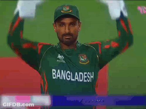 A Man In A Green Bangladesh Jersey Holds His Hands Up GIF