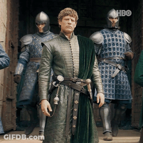 A Man In A Green Coat Is Standing In Front Of A Group Of Soldiers With Hbo Written On The Bottom Right GIF