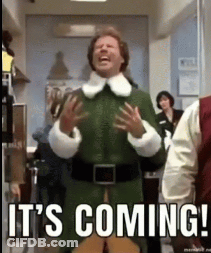 A Man In A Green Elf Costume Is Laughing And Saying `` It 'S Coming '' In A Hallway . GIF
