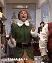 A Man In A Green Elf Costume Is Screaming While Standing In A Room . GIF