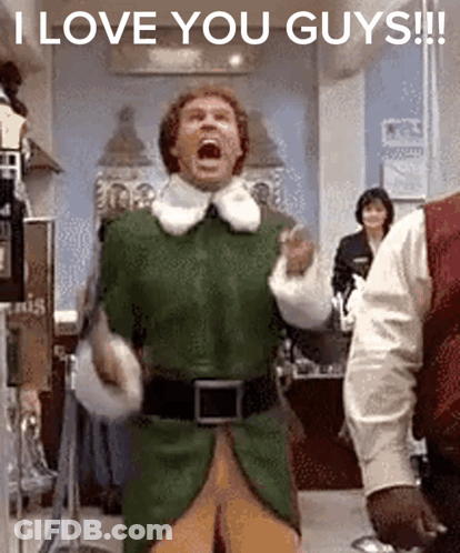 A Man In A Green Elf Costume Is Screaming With The Words " I Love You Guys " Below Him GIF