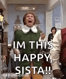 A Man In A Green Elf Costume Is Standing In A Room With His Mouth Open . GIF