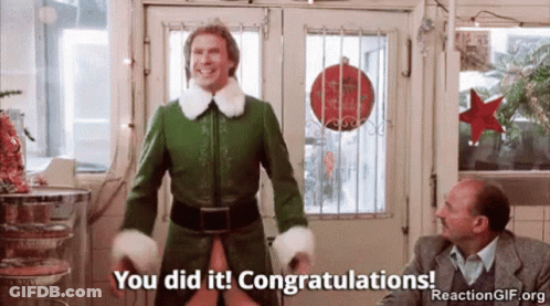 A Man In A Green Elf Costume Is Standing In Front Of A Door And Saying You Did It Congratulations . GIF