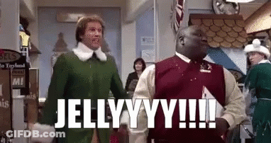 A Man In A Green Elf Costume Is Standing Next To A Man In A Red Sweater In A Store . GIF