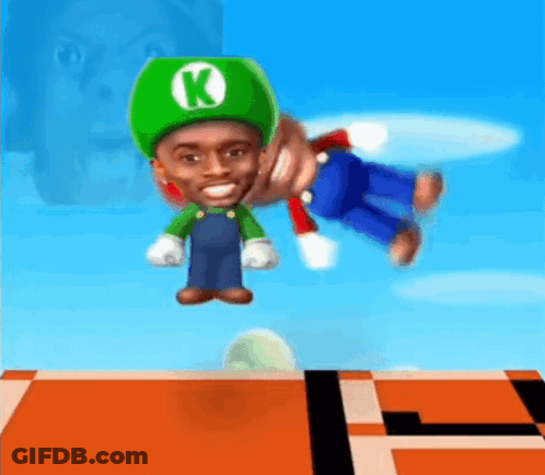 A Man In A Green Hat With The Letter K On It Is Playing A Video Game GIF