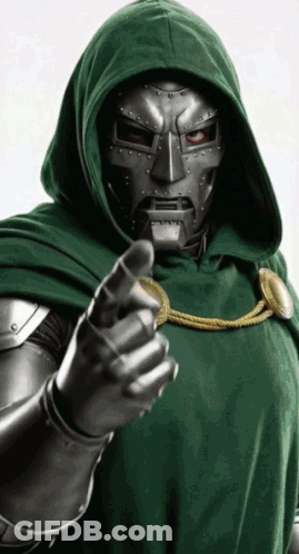 A Man In A Green Hooded Cloak Is Pointing His Finger GIF