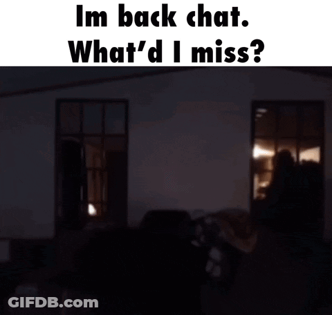 A Man In A Green Hoodie Is Standing In A Dark Room With The Words Im Back Chat What 'D I Miss GIF