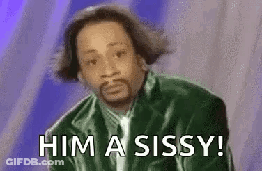 A Man In A Green Jacket And Tie Is Saying `` Him A Sissy '' . GIF