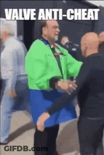 A Man In A Green Jacket Is Being Held By Another Man With The Caption Valve Anti-Cheat Written Above Him GIF