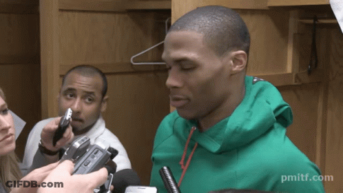 Man In Green Jacket Being Interviewed GIF