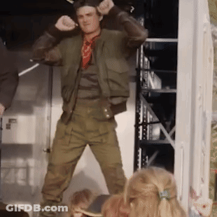 A Man In A Green Jacket Is Dancing In Front Of A Group Of Children GIF