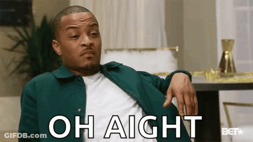 A Man In A Green Jacket Is Sitting In A Living Room With His Hand On His Knee And Says Oh Aight . GIF