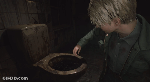 A Man In A Green Jacket Laying On The Ground GIF