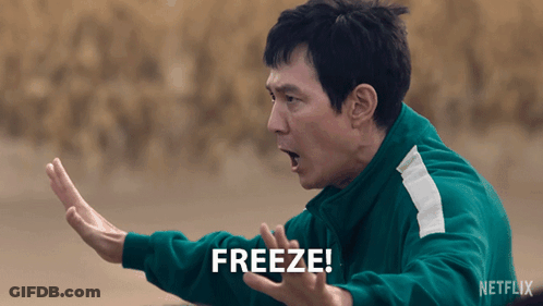 A Man In A Green Jacket Says " Freeze " GIF