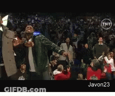 A Man In A Green Jacket Stands In Front Of A Crowd With A Tnt Logo On The Bottom GIF