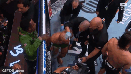 A Man In A Green Jacket With The Word Ufc On His Back GIF