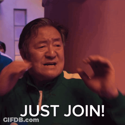 A Man In A Green Jacket With The Words Just Join Written On It GIF