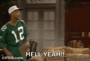 A Man In A Green Jersey Is Standing Next To A Pile Of Logs And Says `` Hell Yeah ! '' GIF