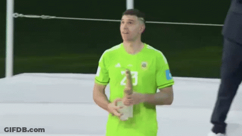 A Man In A Green Jersey With The Number 2 On His Shorts GIF