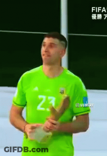 A Man In A Green Jersey With The Number 23 On It Is Holding A Trophy GIF