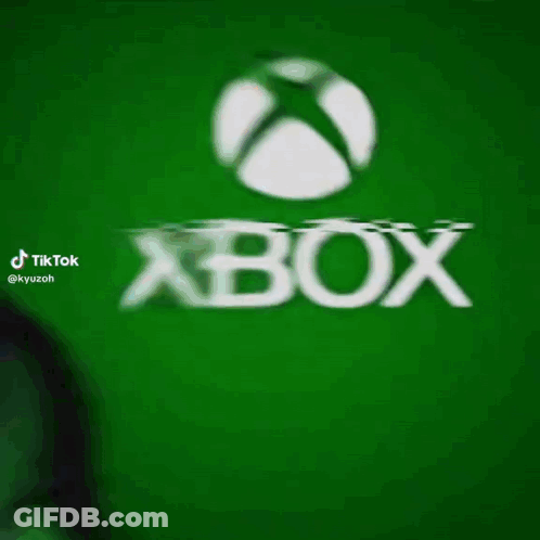 A Man In A Green Mask Is Standing In Front Of A Green Xbox Logo GIF