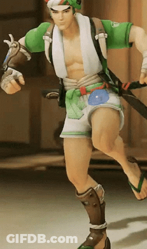 A Man In A Green Shirt And White Shorts Is Running With A Sword GIF
