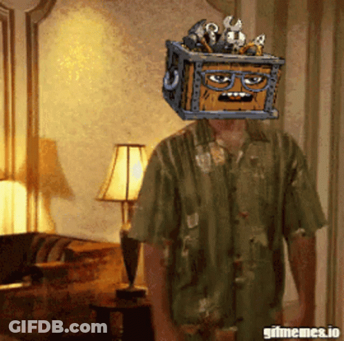 A Man In A Green Shirt Has A Crate On His Head GIF