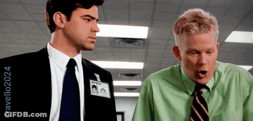 A Man In A Green Shirt Has A Name Tag On His Neck That Says ' William ' On It GIF