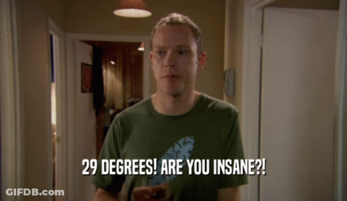 A Man In A Green Shirt Holds A Glass Of Beer And Says 29 Degrees Are You Insane GIF