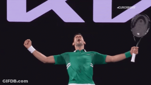 A Man In A Green Shirt Is Holding A Tennis Racket In Front Of A Eurosport Sign GIF