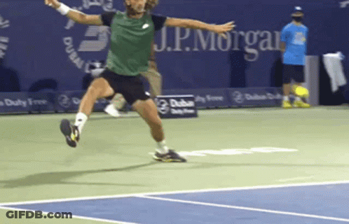 A Man In A Green Shirt Is Jumping In The Air On A Tennis Court With J.p. Morgan In The Background GIF