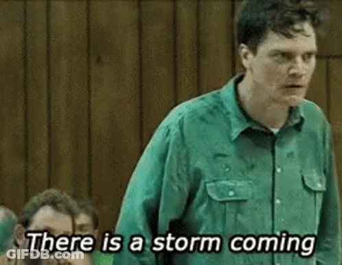 A Man In A Green Shirt Is Saying There Is A Storm Coming . GIF