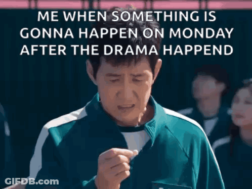 A Man In A Green Shirt Is Standing In Front Of A Group Of People And A Sign That Says Me When Something Is Gonna Happen GIF