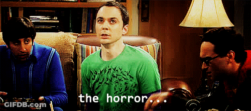 A Man In A Green Shirt Says " The Horror " In Front Of Two Other Men GIF