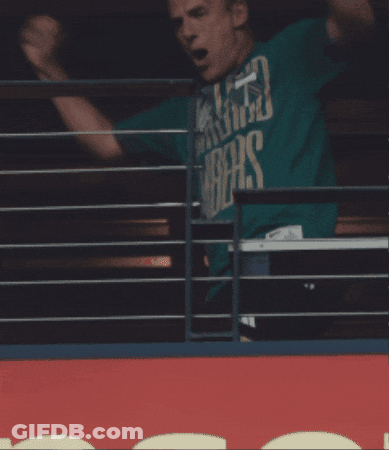 A Man In A Green Shirt That Says ' Washington ' On It GIF
