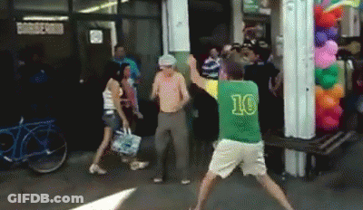 A Man In A Green Shirt With The Number 10 On It Is Dancing GIF