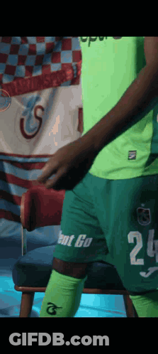 A Man In A Green Shirt With The Number 25 On It GIF