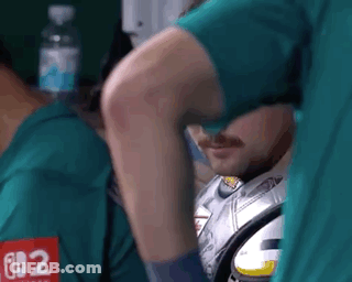 A Man In A Green Shirt With The Number 62 On It GIF