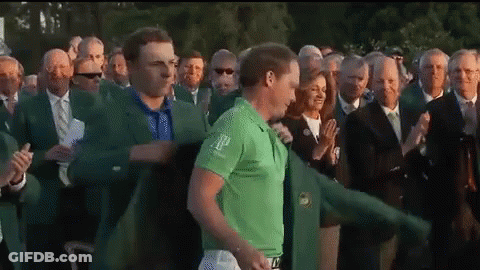 A Man In A Green Shirt With The Word Ap On It Stands In Front Of A Crowd Of People GIF