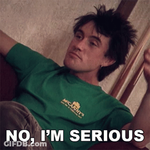 A Man In A Green Shirt With The Words No I 'M Serious GIF