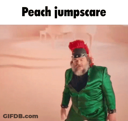 A Man In A Green Suit And A Red Hat Is Standing In The Sand . GIF