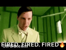 A Man In A Green Suit And Bow Tie Is Saying `` Fired . Fired . Fired . '' GIF