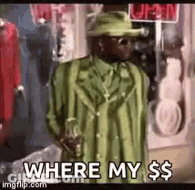 A Man In A Green Suit And Hat Is Standing In Front Of A Store And Asking Where My Money Is . GIF