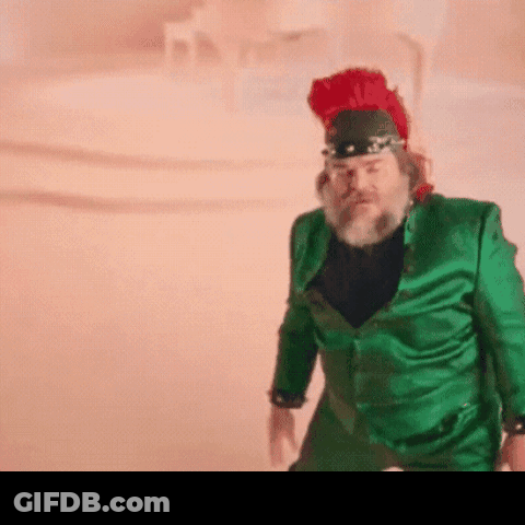 A Man In A Green Suit And Red Hat GIF