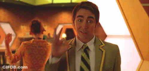 A Man In A Green Suit And Tie Is Waving At A Woman GIF