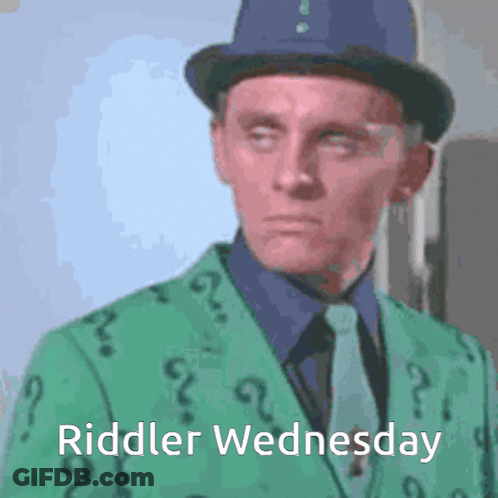 A Man In A Green Suit And Top Hat With The Words Riddler Wednesday Written Below Him GIF