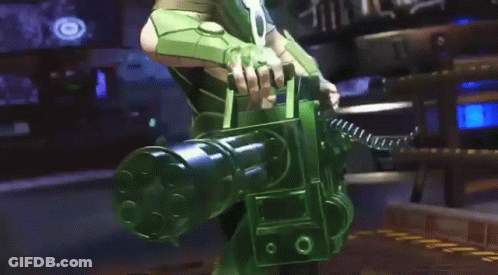 A Man In A Green Suit Is Standing In A Room With A Gun . GIF