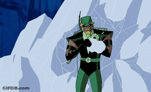 A Man In A Green Suit With The Letter G On His Chest Is Holding An Arrow GIF