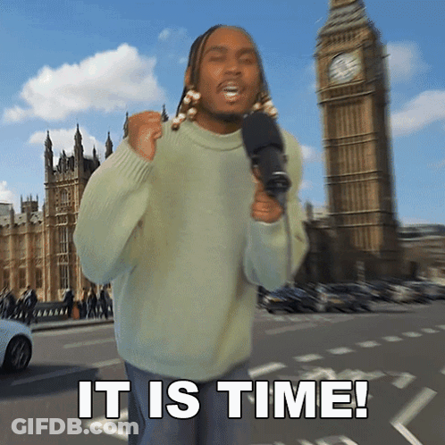 Man In Green Sweater Holds Microphone Near Big Ben GIF