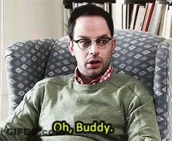 A Man In A Green Sweater Is Sitting In A Chair And Saying Oh Buddy GIF